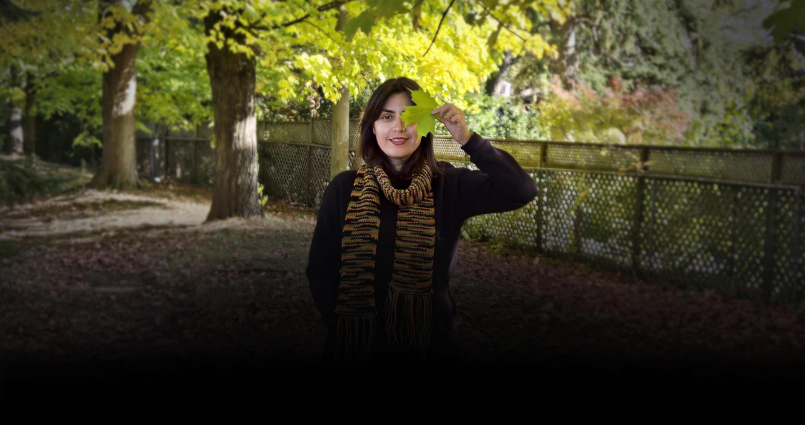 Portrait of Eli Irani, product designer, with minimal background.